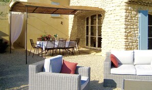 View from terrace seating area looking towards outdoor dining area.