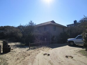 view of Captain's Quarters corner lot from Dolphin Run - MORE HOUSE PHOTOS SOON