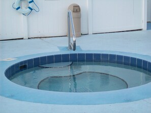 Jacuzzi near pool area.