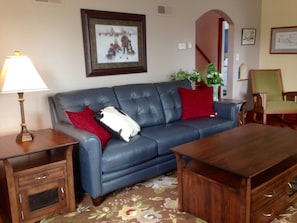 Comfortable living room with Amish-made tables & leather  couch