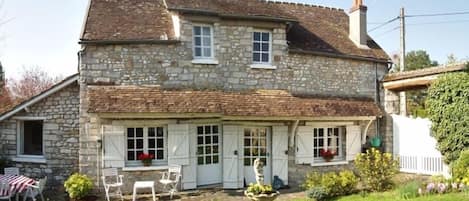 Outside view with patio and enclosed garden