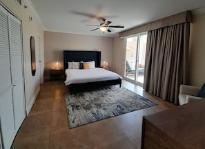 Master bedroom with private balcony 
all TVs are smart. 