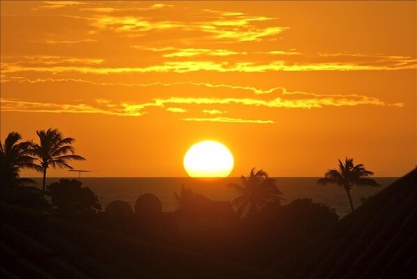 The private rooftop view of the sun setting
 