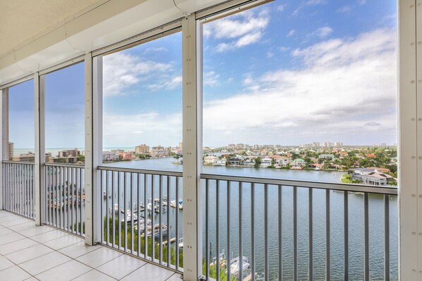 Your view of The Gulf of Mexico and Vanderbilt Bay from the screened Lanai