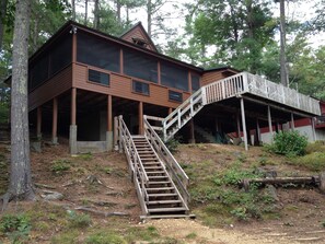 Huge lakeside cottage with wrap around outdoor deck and easy beach access.