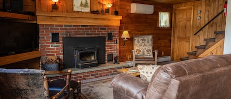 Enjoy the warmth of knotty pine and a wood burning stove.
