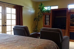 Comfy recliners, 37" flat screen TV with HD cable and movie channels, and door to private balcony