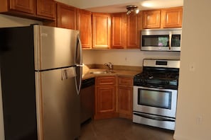 Recently renovated cozy kitchen features stainless steel Frigidaire appliances
