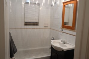 Windowed full bathroom with lake view.