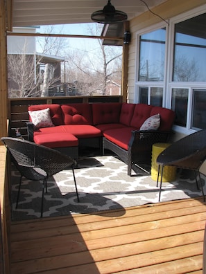 The screened in deck space faces the lake and is off of the living room. 
