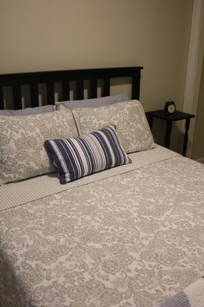 A comfortable bed in a private room for two.