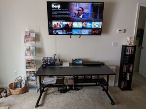 Large work desk and 55 inch TV in living room