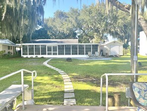 Back of house with paver patio and fire pit 