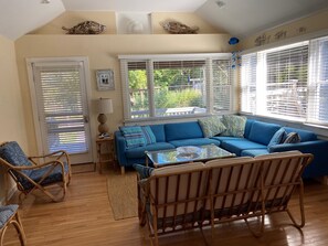 With three expansive windows, the living room is suffused with natural light.