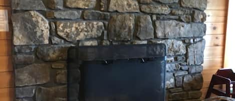 Fireplace, made by locally retrieved rock and   built by a local craftsman.