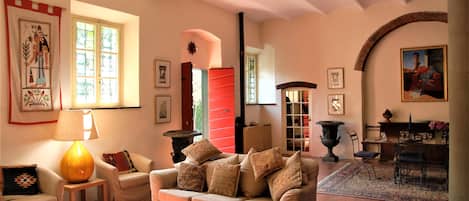 The charming ground floor of the mill is spacious and airy with comfy sofas 