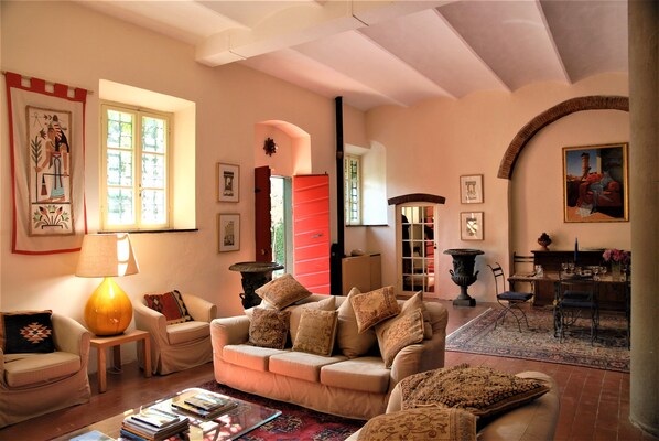 The charming ground floor of the mill is spacious and airy with comfy sofas 