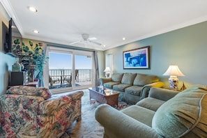 LARGE LIVING ROOM WITH COUCH/LOVE SEAT & CHAIR OVERLOOKS BEACH & OCEAN. 