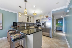 VIEW OF OPEN FLOOR PLAN FOR THIS LARGE KITCHEN. RECESSED LIGHTING & WASHER/DRYER