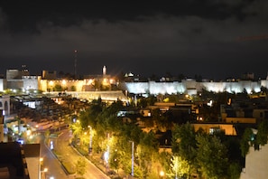 Night view of Old City walls from balcony.
