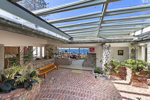 Atrium entry brings indoor/outdoor feel and tons of natural light.
