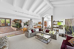 Open floor plan living room and atrium entry.