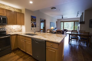 Fully equipped kitchen with barstools