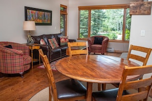 Comfortable living room and dining table with six chairs