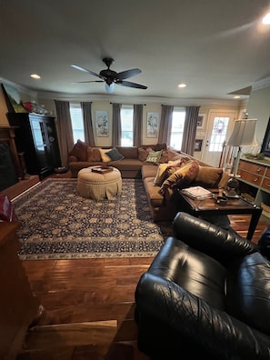 large living room with sectional and 2 recliners