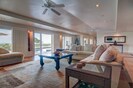 spacious living room leads out to the pool area
and beach just beyond