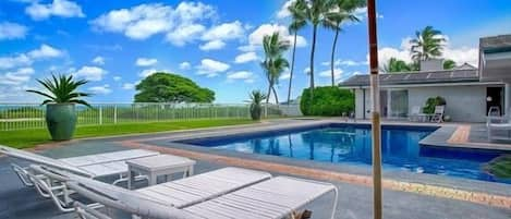 Relax in the sun by the beautiful tiled pool