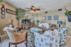 Living room with lots seating for talking or TV or ocean wave watching.