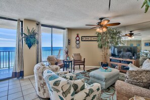 Living room with lots of comfortable seating.