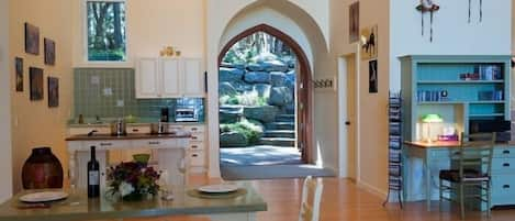 View from the dining area with wide open front doors.