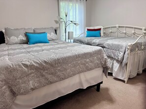 Bedroom 1, located downstairs (queen, twin).
