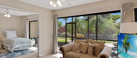 Open living area with glass sliders to lanai