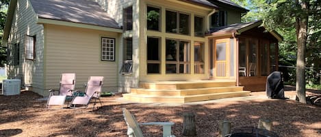 Rear view of the house, deck and backyard