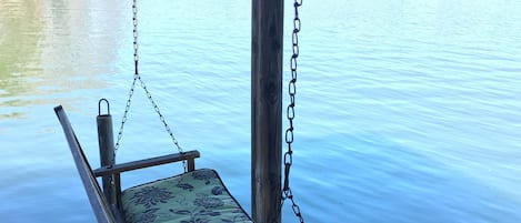 Porch swing on the dock - a great place to read a book or watch the swimmers