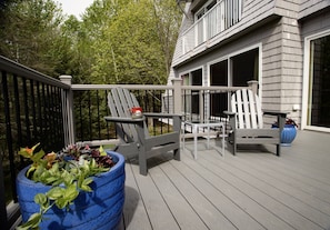 Expansive deck beyond dining and living areas