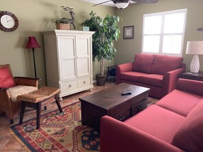 Living room, open floor plan, with tile throughout the home.