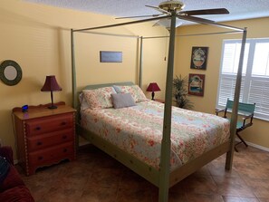 Master bedroom with queen bed, large walk-in closet and an on-suite bath.