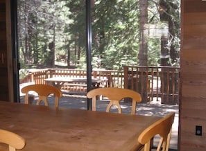 View of deck and back yard from dining area