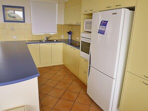 the kitchen is a fully set up for cooking and baking    