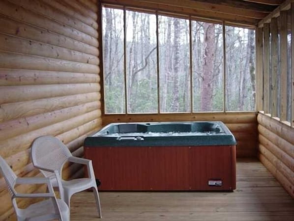 Private hot tub on a screened back porch with a mountain view late fall-spring
