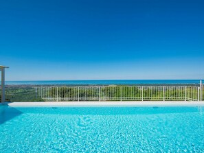 Water, Sky, Water Resources, Plant, Blue, Rectangle, Natural Landscape, Coastal And Oceanic Landforms, Grass, Tree