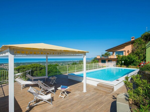 Sky, Water, Property, Plant, Furniture, Swimming Pool, Chair, Building, Outdoor Furniture, Shade