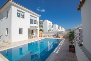 Garden with barbecue, seating area, sun loungers and private pool