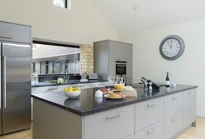 Ground floor: Open-plan modern and fully equipped kitchen
