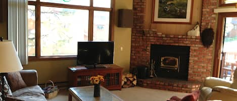 Livingroom with wood burning stove and 40' flat panel TV