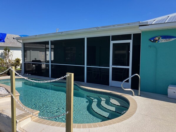 Heated pool and screened lanai. 
